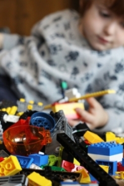 Child with Lego toys
