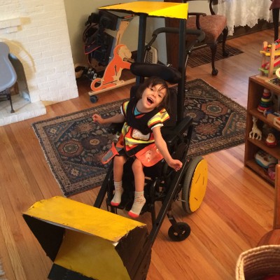Elena in bulldozer costume in wheelchair