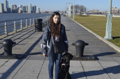 Blogger BlindBeader and guide dog Jenny waiting for a water taxi during a visit to NYC.