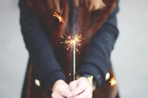 A person holding a sparkler