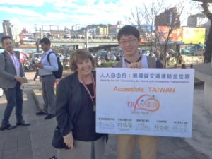 Easterseals’ Judy Shanley with Eden Social Welfare Foundation Host and Banner Acknowledging the Commitment of Mayors across Taiwan to Accessible Transportation
