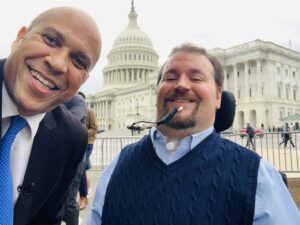 Ben and Senator Cory Booker in front of the U.S. Capitol