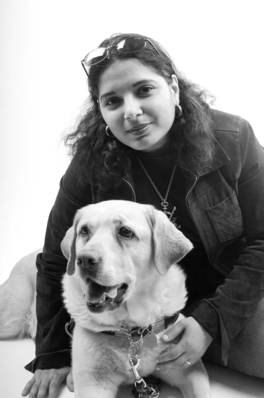 Day and her yellow lab guide dog